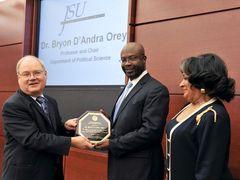 Dr. Orey receiving an award for his dedication to diversity advancement from Mr. Alan Perry (L), member of the Board of Trustees of State Institutions of Higher Learning and Dr. Carolyn Meyers (R), President of Jackson State University