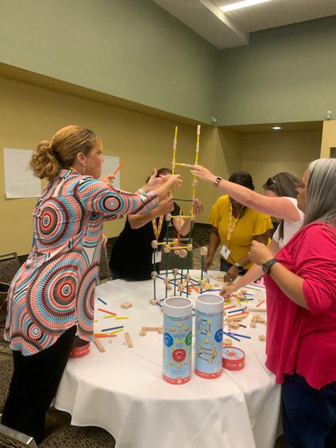 Picture of teachers taking part in Tinker Toy activityy