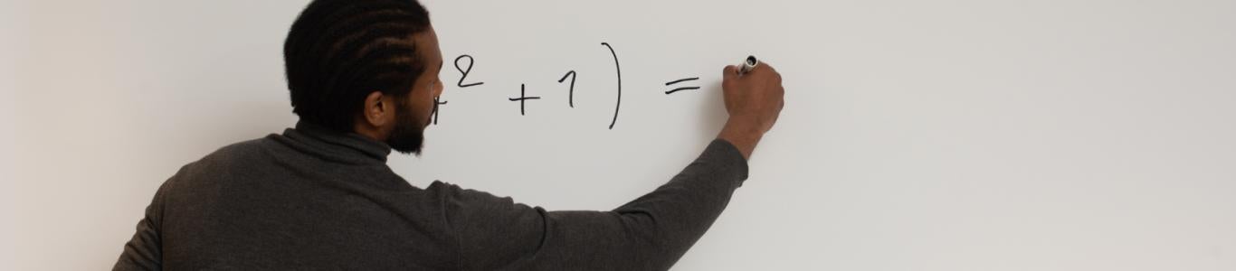 Math teacher at a whiteboard