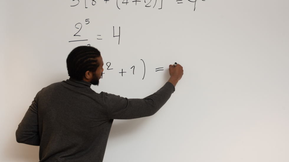 Math teacher at a whiteboard