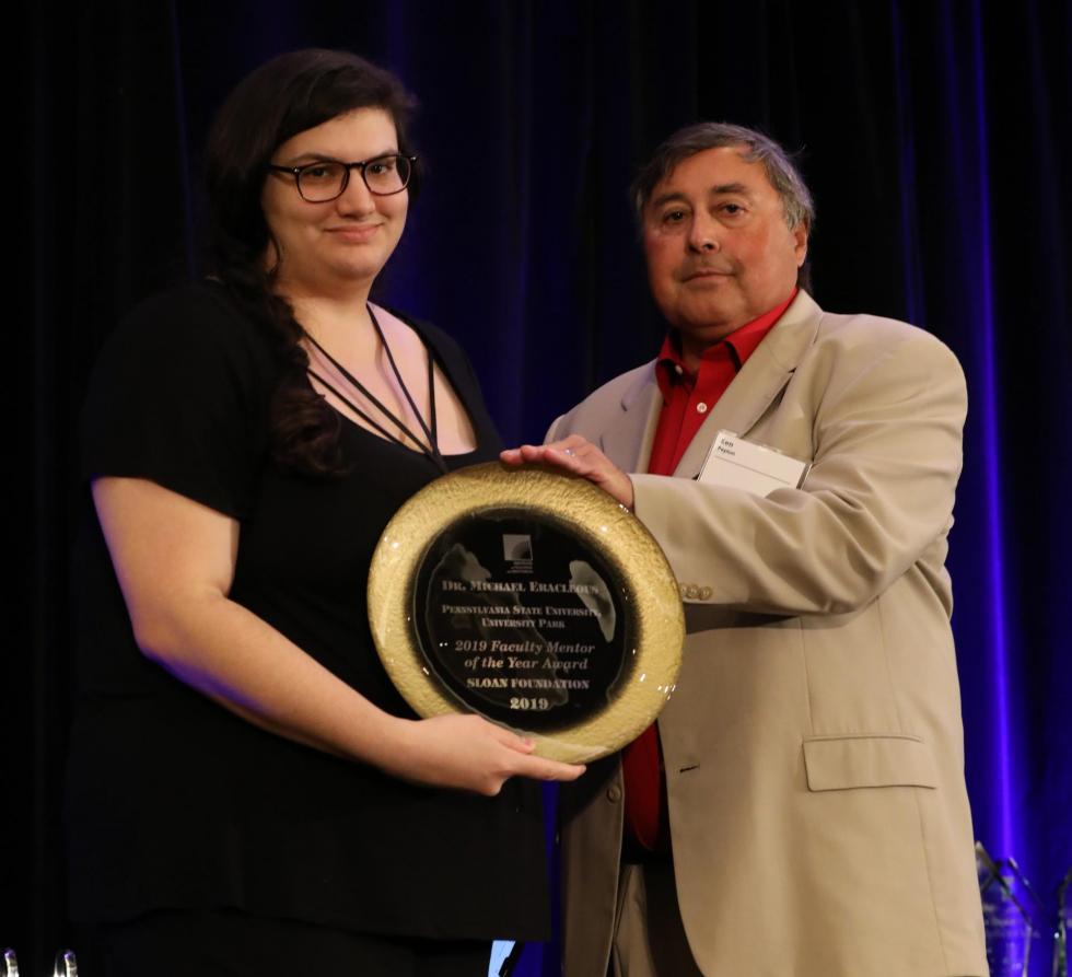 Sloan Scholar Mallory Molina accepts the award from Dr. Ken Pepion on behalf of Dr. Eracleous