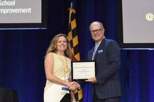 Picture of Sarah Potter receiving the 2019 Outstanding Math Coach Award