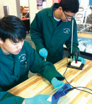 Students measure radiation emitted from radioactive sources.