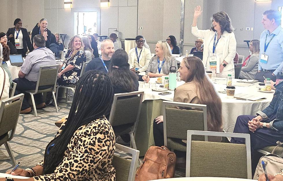 Attendees having fun while they learn at the coaching conference