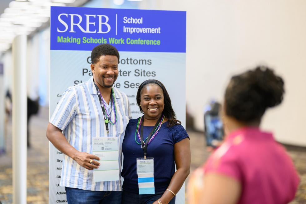 2025 attendees pose for a photo
