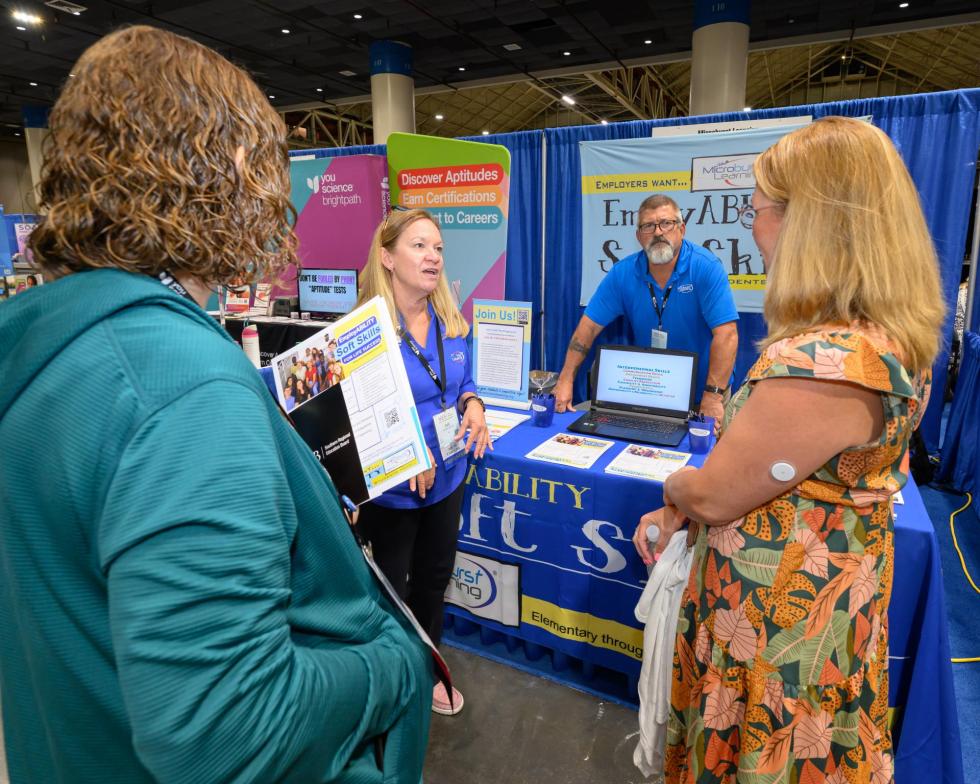 2025 attendees talk to exhibitors