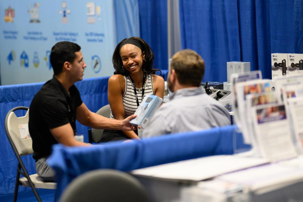 Attendees at the 2025 conference talk to exhibitors
