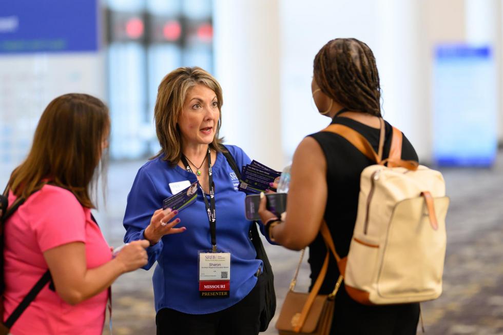 SREB worker helps 2025 attendees