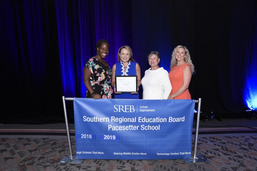 Picture of St. Marys' staff with the Gene Bottoms Pacesetter Award