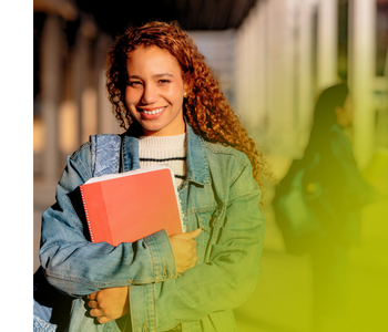 A young, Gen Z student wearing a backpack and holding a notebook.