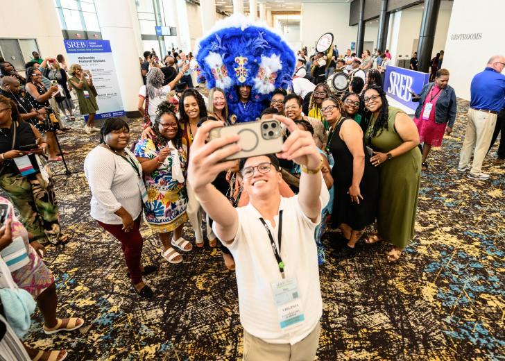 2025 attendees take a group selfie