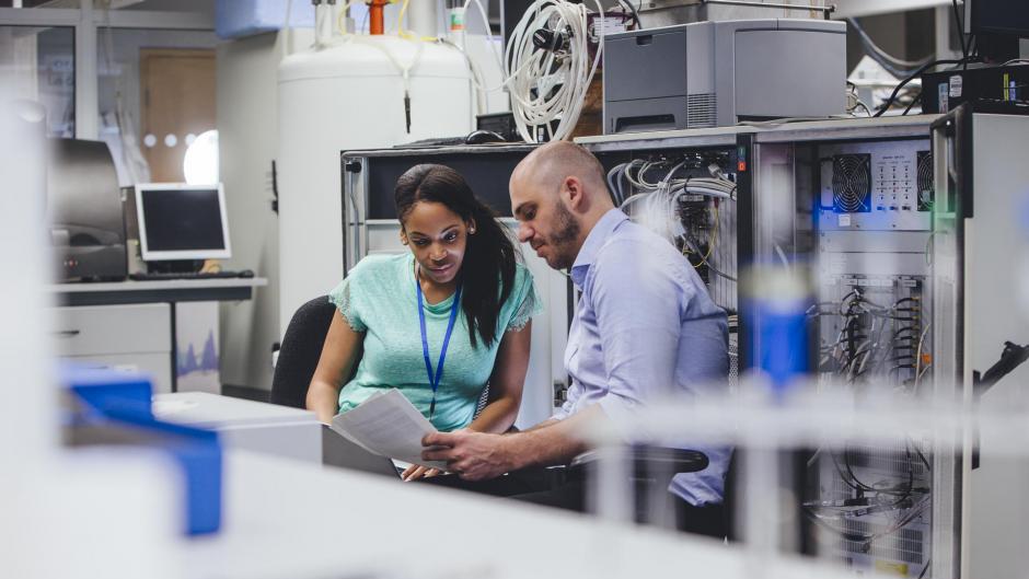 An IT teacher and student investigate a network