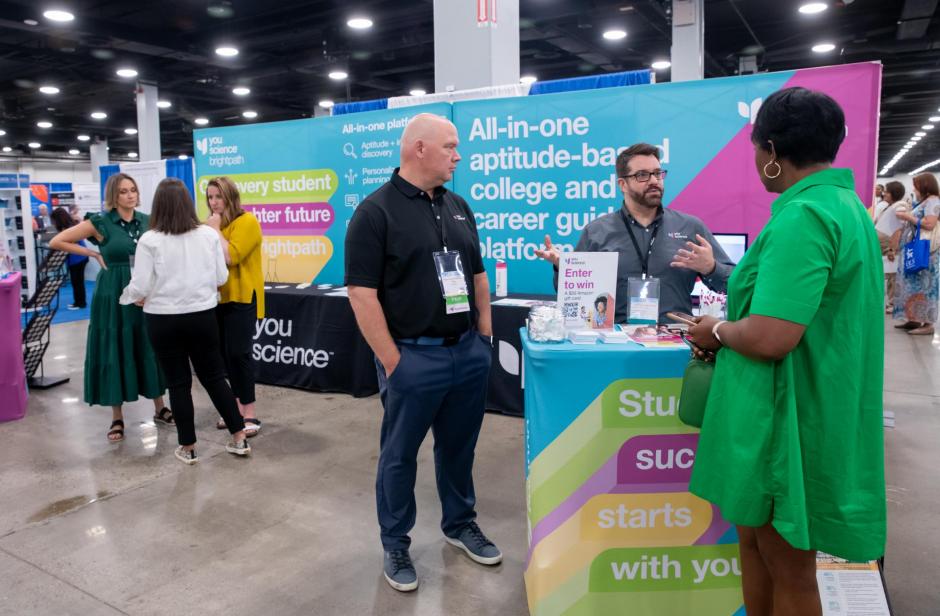 Attendees visit the YouScience booth