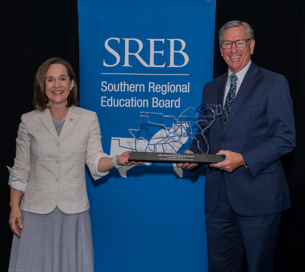 Valerie Greenhill and former Sen. Bob Plymale holding an SREB award for Distinguished Service
