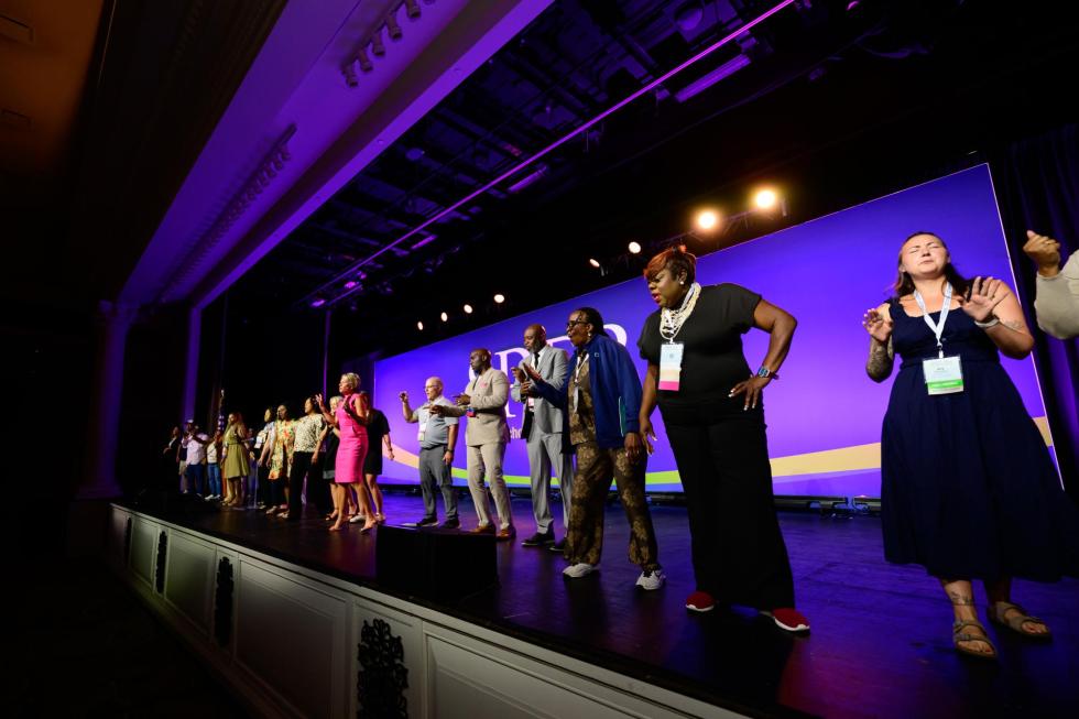 2026 attendees go on stage at the 2026 conference.