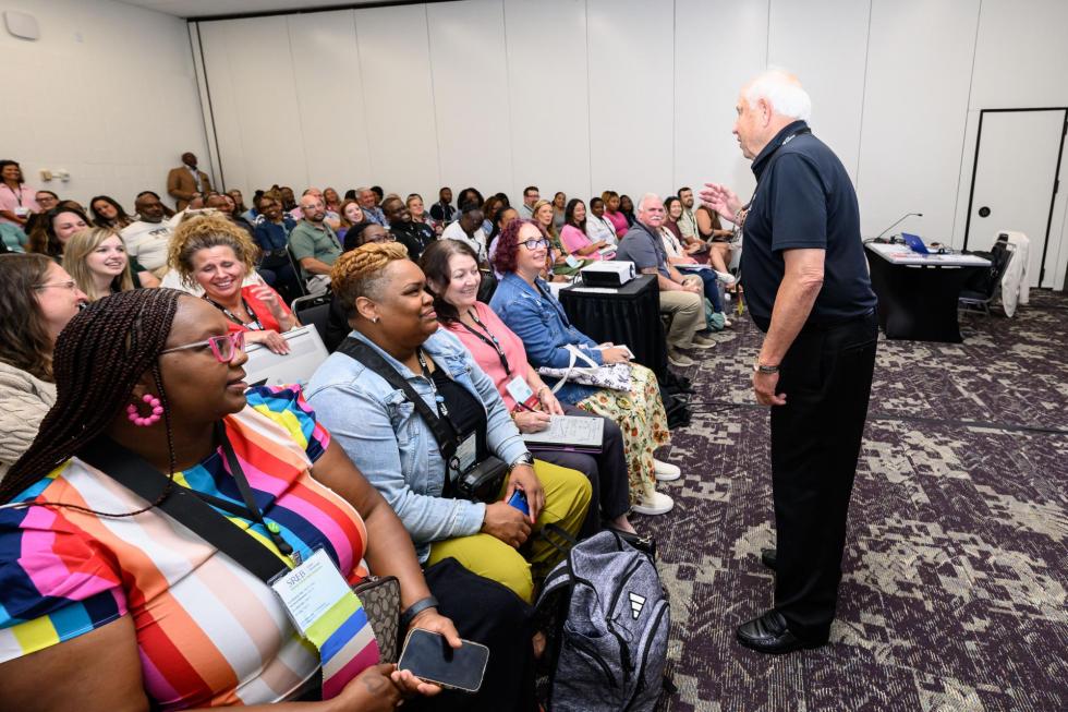 2025 Attendees listen in a session.
