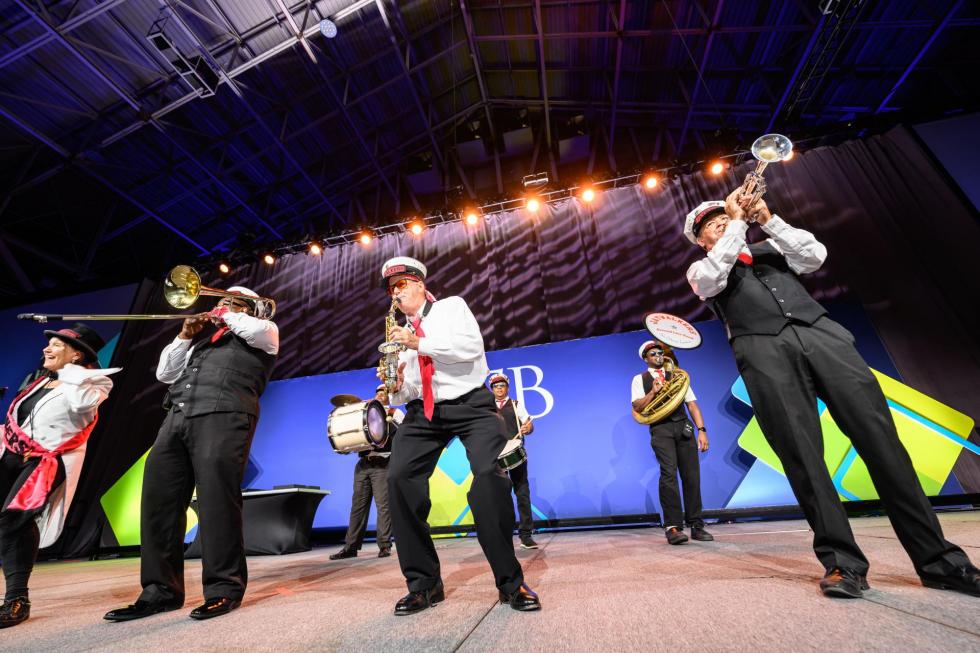 A New Orleans Second-Line Band plays on stage at the 2025 Conference.