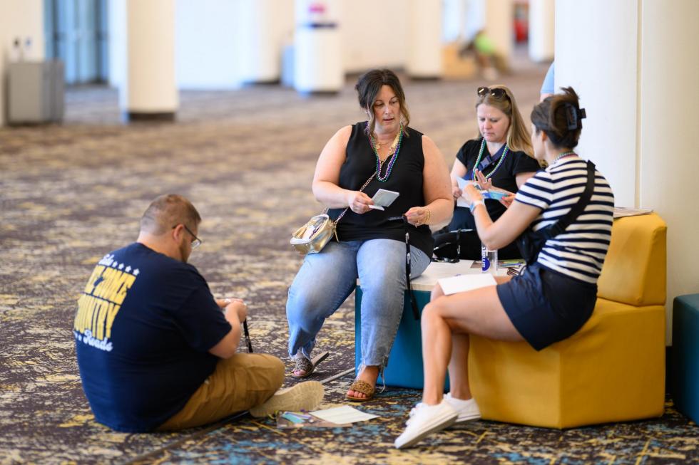 Attendees sit and talk at the 2025 conference.