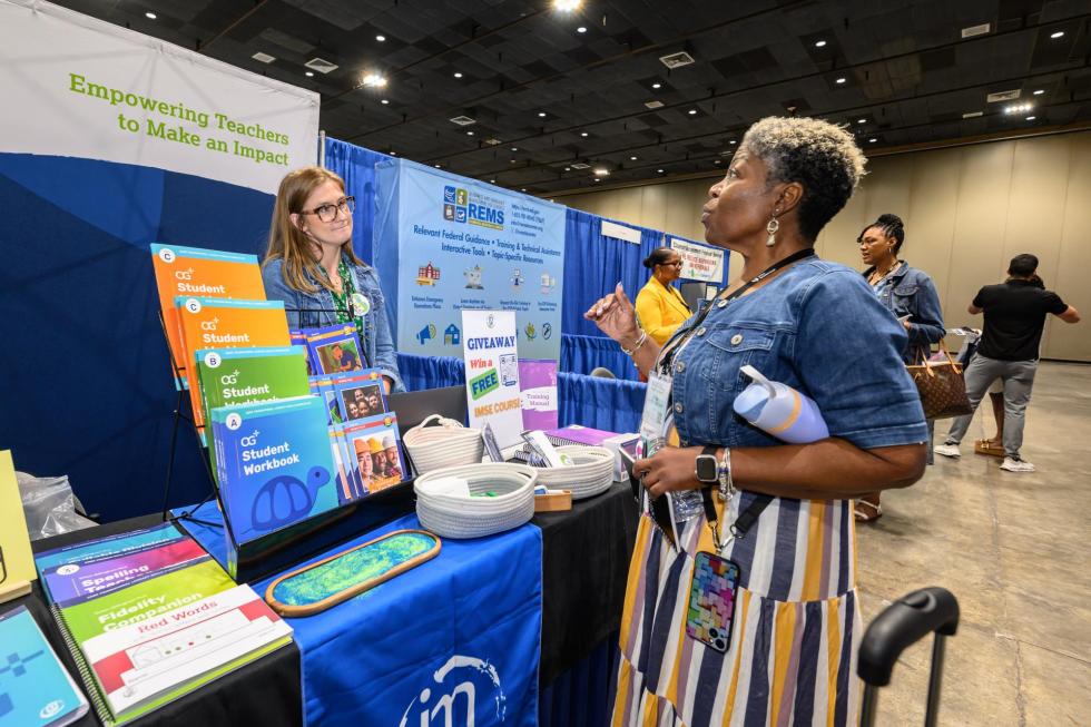 Attendees at the 2025 conference talk to exhibitors