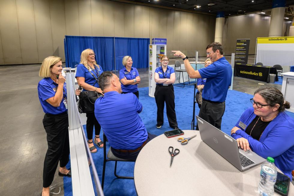 SREB team members gather for a meeting at the 2025 conference